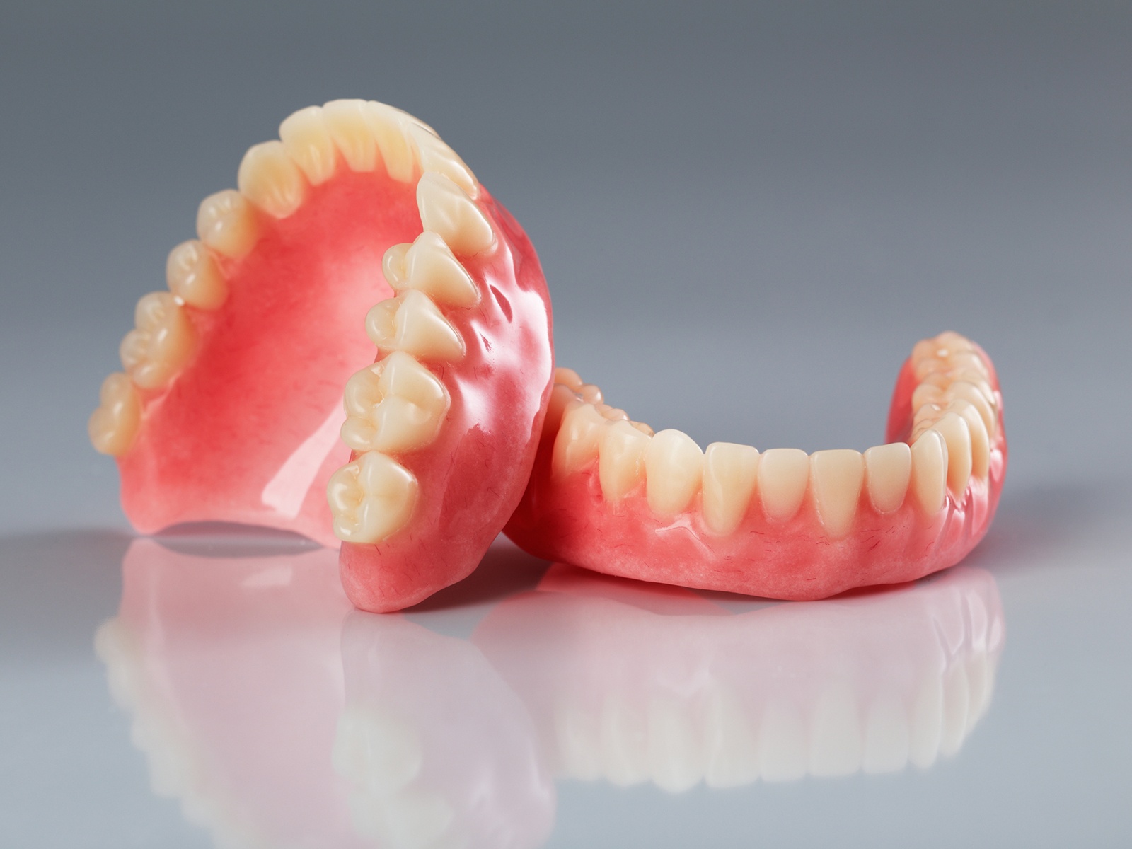 Are implant retained dentures worth it?